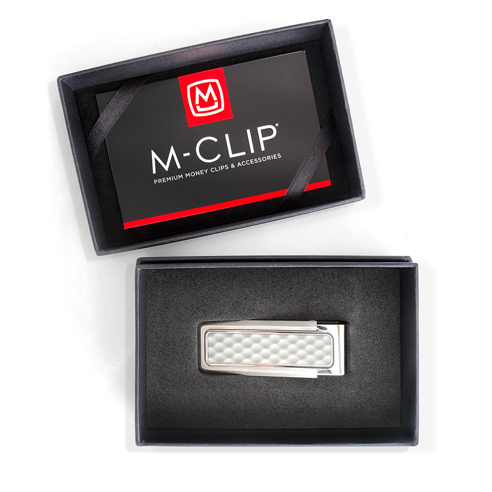 Golf ball money clip holding cash and cards