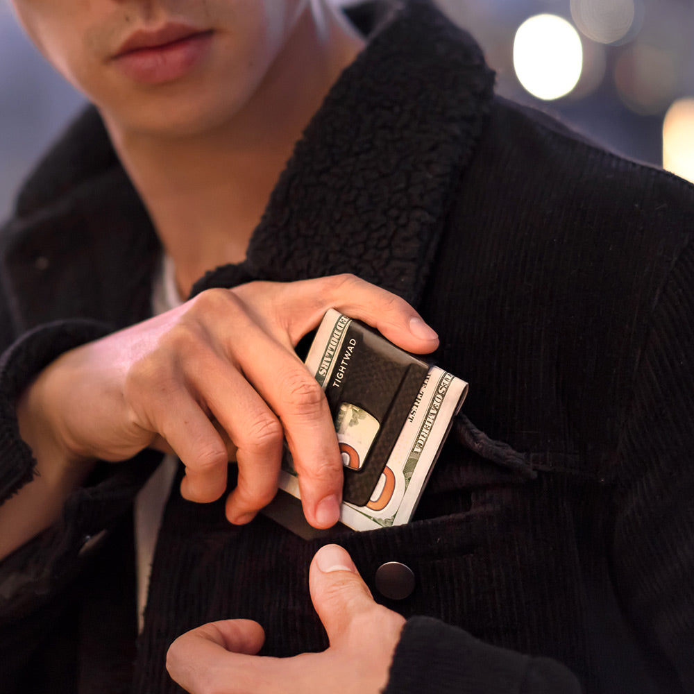 Tightwad carbon fiber money clip flat lay view