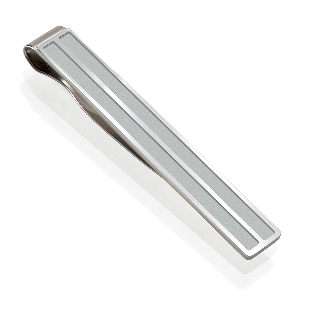 Steel channeled tie clip with recessed brushed pockets