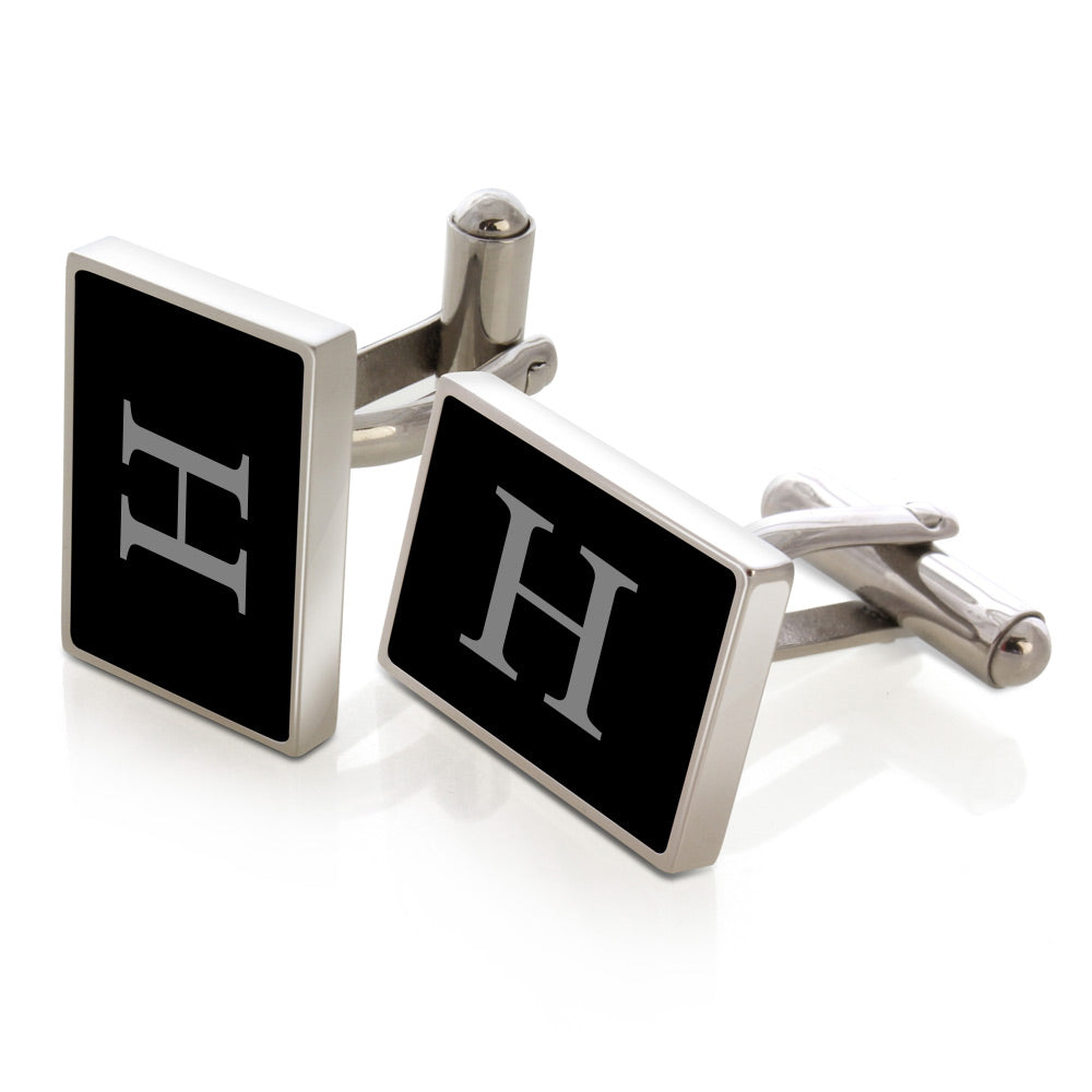 Black enamel cufflinks with laser-engraved initials
